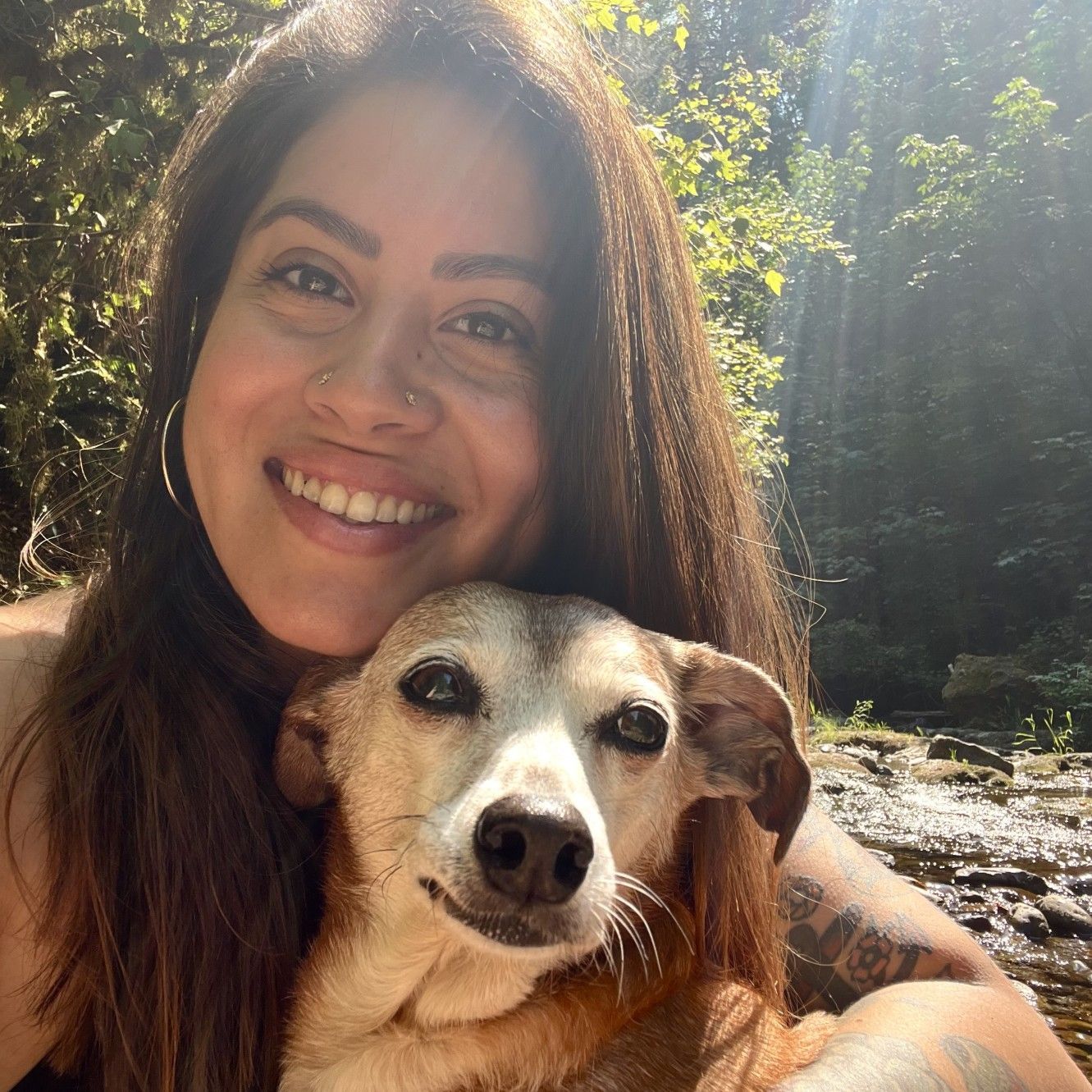 Jasmine holding a small dog